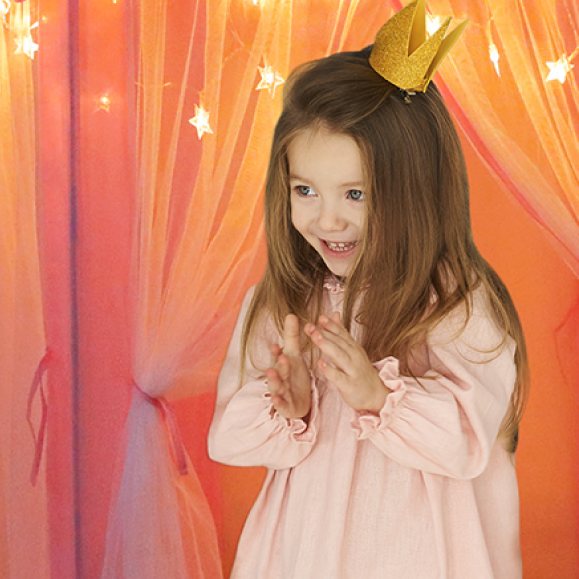 Girl in a gold crown under Orian castle tent starlights
